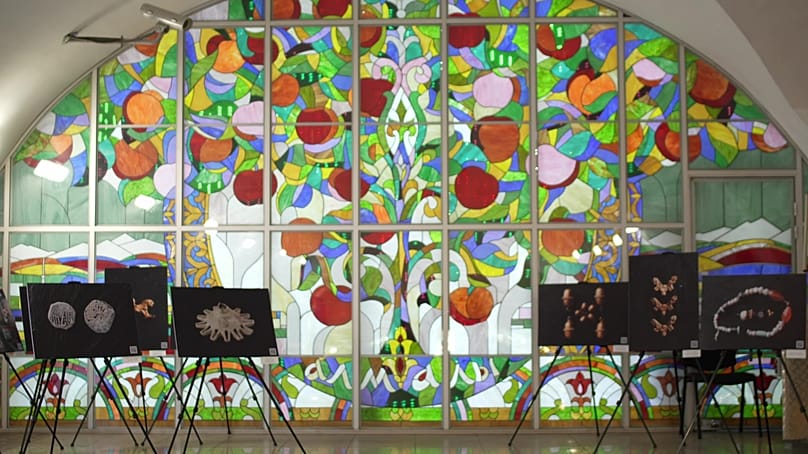 'Almaly' metro station in Almaty, decorated with apple-themed mosaics.  