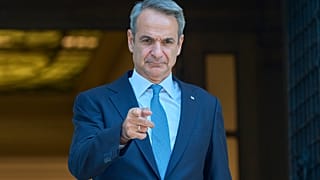 Greece's Prime Minister Kyriakos Mitsotakis, gestures as he waits the arrival of King of Bahrain Hamad bin Isa Al Khalifa before their meeting, in Athens, on Friday, Sept. 18.