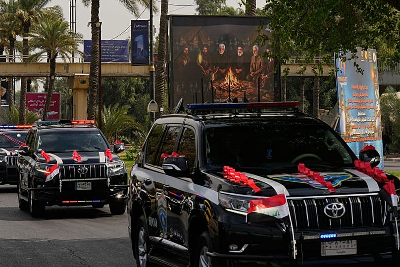 Iraqi security vehicles decorated with ribbons during a convoy celebrating the complete withdrawal of US troops from Iraq, Baghdad, Wednesday, 30 Sept. 2026