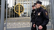FILE: Police officers guard the Moscow City Court entrance, in Moscow, 17 April 2023