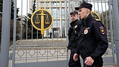 FILE: Police officers guard the Moscow City Court entrance, in Moscow, 17 April 2023