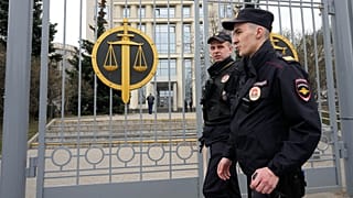 FILE: Police officers guard the Moscow City Court entrance, in Moscow, 17 April 2023