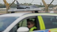 A B1 bomber prepares to take off as police officers man a checkpoint near RAF Fairford air base in Fairford, 29 September, 2026