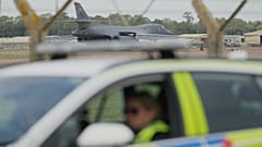 A B1 bomber prepares to take off as police officers man a checkpoint near RAF Fairford air base in Fairford, 29 September, 2026