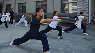 Students practice at the Wudang Taoist Traditional Kung Fu Academy near Wudang Mountain in Shiyan city in central China's Hubei province on Friday, Sept. 4, 2026.