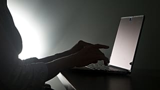 FILE - In this Dec. 12, 2016, file photo illustration, a person types on a laptop in Florida. Riviera Beach, Fla.,