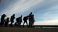 Asylum-seekers trying to enter Greece from the Turkish border