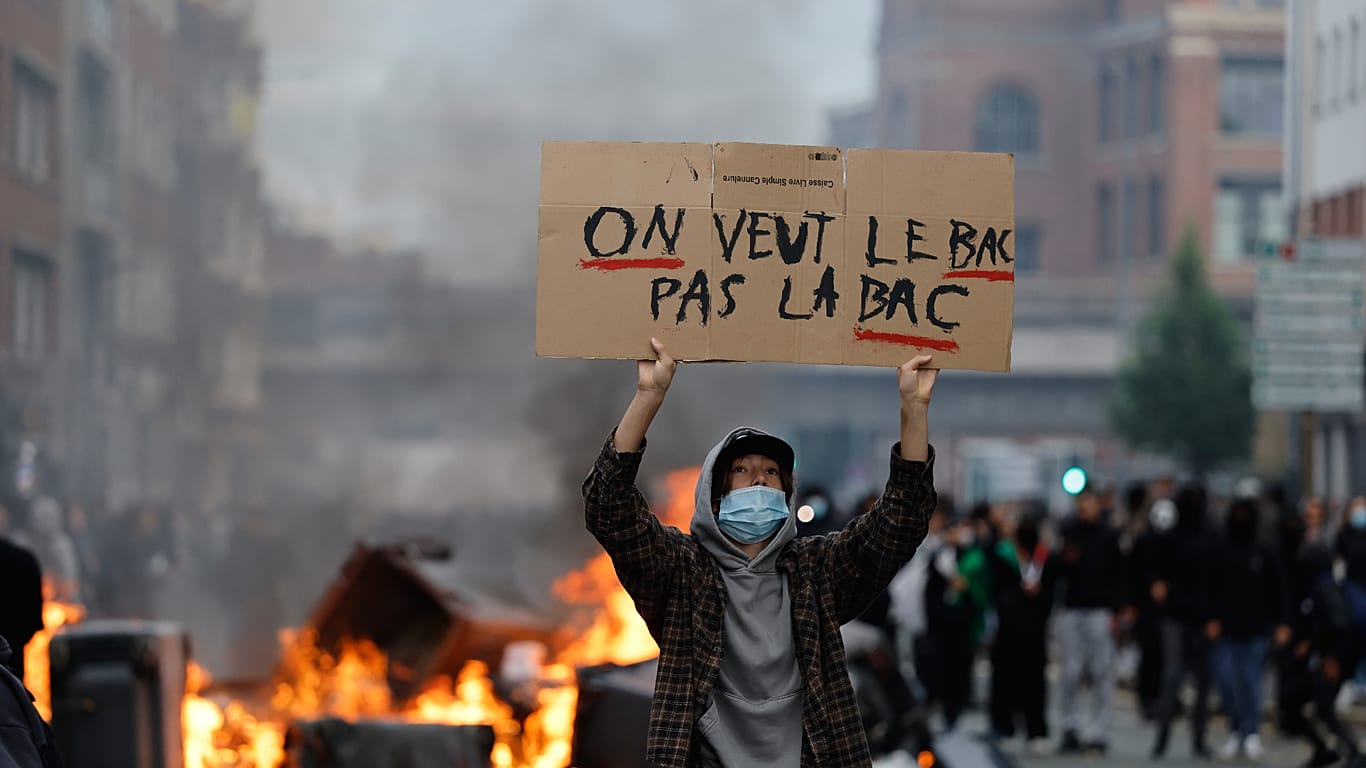 Student holds sign 'we want BAC Not the BAC' at school protest in Lille, France, Thursday, Oct. 1, 2026.