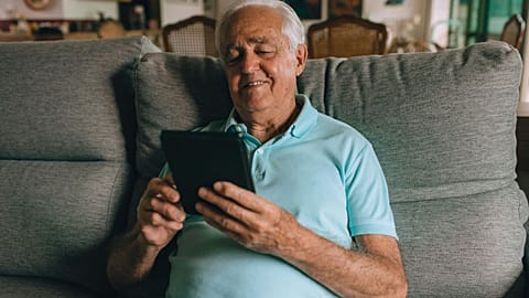 Elderly man with tablet
