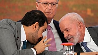FILE - Brazil's Attorney General Jorge Messias leans over to speak with President Lula da Silva at a signing ceremony at the presidential palace, in Brasilia, Oct. 25, 2024