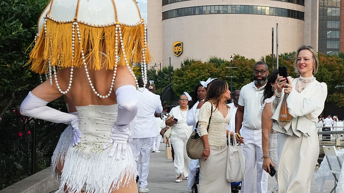 People arrive at the Diner en Blanc event Thursday, Oct. 1, 2026, in New York.