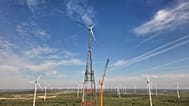 A newly constructed wind turbine, whose rotor tips reach a maximum height of 365 meters (1,198 feet), stands in Schipkau, Germany, Thursday, Oct. 1, 2026