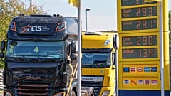 A fuel station shows record fuel prices beside trucks on a highway in Herten, Germany, one day before the German government starts a fuel tax discount, Wednesday, Sept. 30, 20