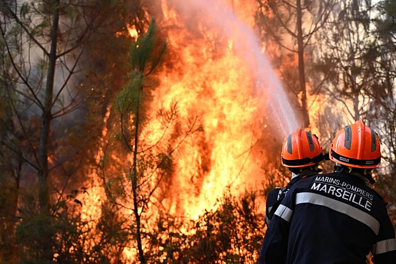 Firefighters work to extinguish a fire in the forest near Blagon, 29 July, 2026