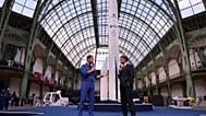French European Space Agency astronaut Thomas Pesquet, left, and French President Emmanuel Macron speak during the International Space Summit at the Grand Palais in Paris.