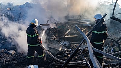 A rescue worker extinguishes a fire at a residential house destroyed by a Russian airstrike in Kharkiv, Ukraine, Friday, 2 October 2026.