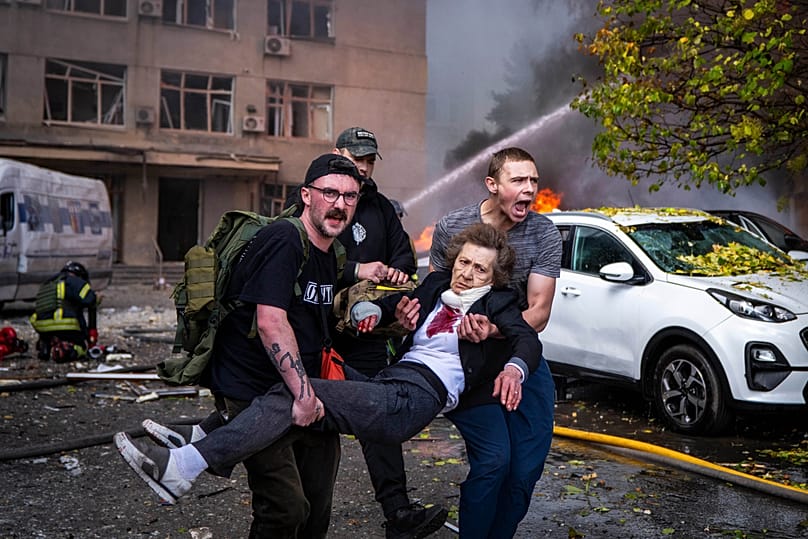 People carry an injured woman into an ambulance after a Russian drone strike in Kyiv, Ukraine, Monday, 28 September 2026.