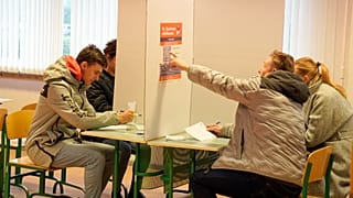 FILE: Polling stations opened Saturday in Latvia for a general election, Riga, Latvia, Saturday, Oct. 1, 2022.