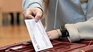 A voter casts his ballot at the parliamentary election at a polling station in Riga, Latvia, Saturday, Oct. 3, 2026. 