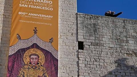 Nuns stand outside the Basilica of St Francis in Assisi, where the saint's bones go on first public display to mark 800 years since his death, on Sunday.