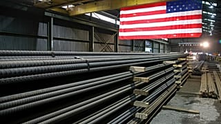 In this 9 May 2019, photo, steel rods produced at the Gerdau Ameristeel mill in St. Paul, Minnesota await shipment.