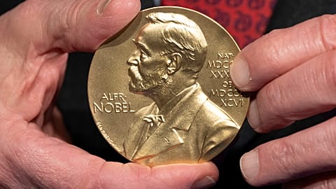FILE - A close-up view of a Nobel Prize medal at the National Institutes of Health (NIH) in Bethesda, Md., Dec. 8, 2020.