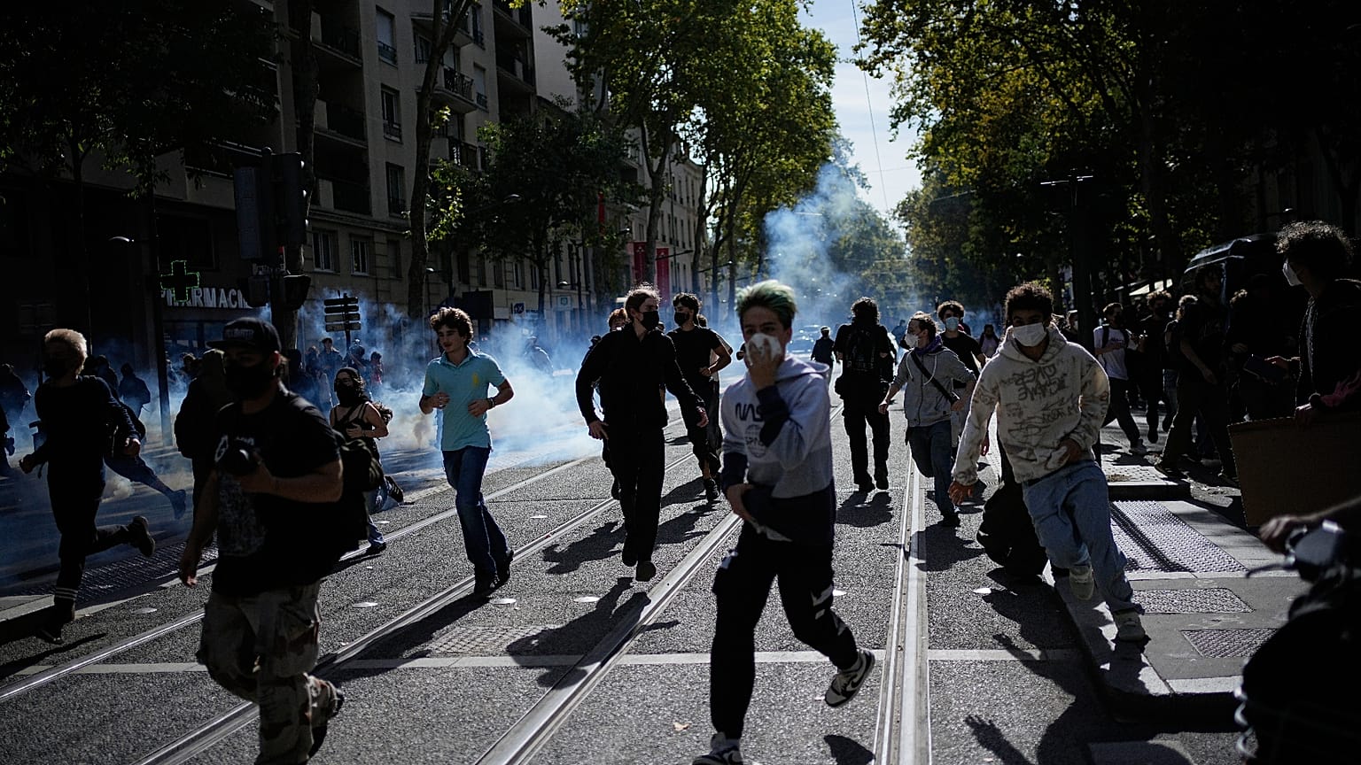 Students run out the teargas during a protest against under-resourced schools in Lyon, France, 2 October 2026.