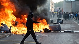 Students burn garbage as they protest to demand more resources at school, in Lille, France, Thursday, Oct. 1, 2026. 