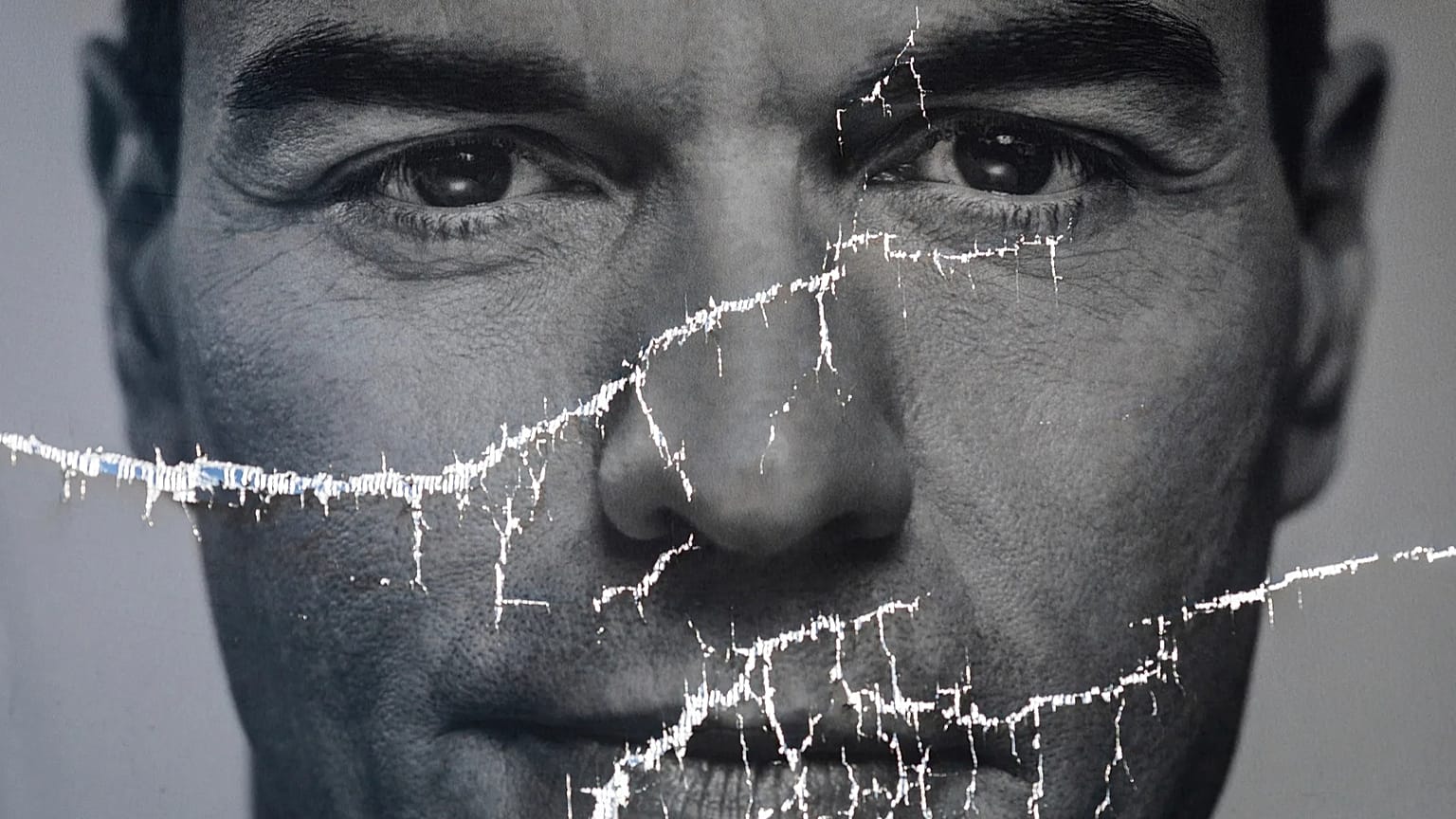 A partially damaged poster of Spanish Prime Minister Pedro Sánchez flaps in Parla, Spain, 26 April 2019. 