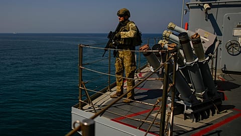 FILE: A Turkish army soldier stands guard on one of two ships sailing in the Mediterranean Sea, heading from the port of Mersin, Turkey, to the port of Beirut, 9 October 2024