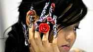 A model shows off decorated fingernails during a 3D nail art competition in Singapore on Feb. 26, 2008.