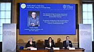 A portrait of Francis Halzen is shown on the screen as the panel announce the recipient of the 2026 Nobel Prize in Physics at the Royal Swedish Academy of Sciences, Stockholm.