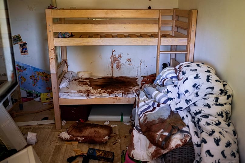 Blood is splattered in a child's room following the Oct. 7 massacre by Hamas militants in Kibbutz Nir Oz, Israel, as seen on Oct. 19, 2023. (AP Photo/Francisco Seco)