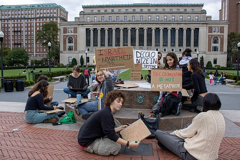 Anti-Israel Demonstrators gather with signs near the Butler Library on the Columbia University campus, New York City on Sunday, October 8, 2023. (AP Photo/Ted Shaffrey)