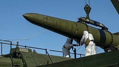 Russian troops load an Iskander missile onto a mobile launcher during drills at an undisclosed location in Russia. Feb. 2, 2024.