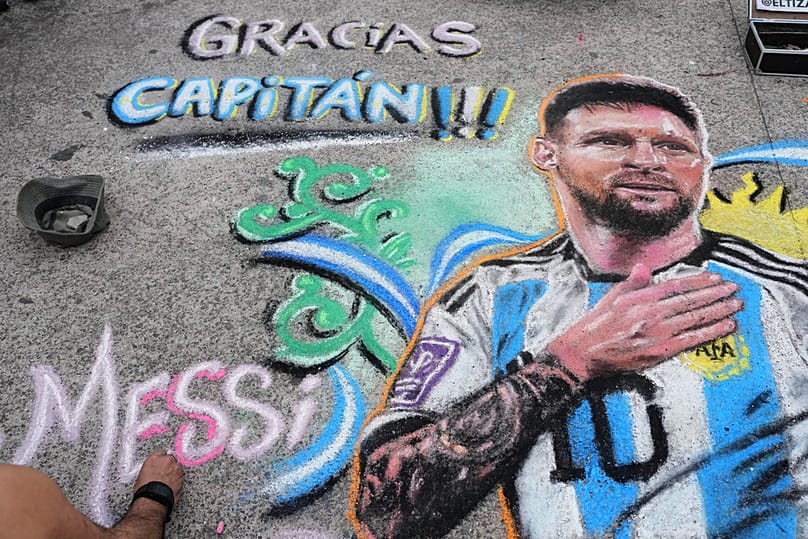 Chalk portrait of Lionel Messi on the pavement outside the stadium before Messi's final match with the national team, in Buenos Aires, Argentina, Tuesday, Oct. 6, 2026