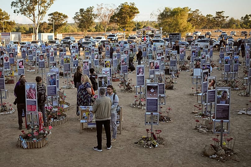 Photographs of the victims of the Hamas attacks have been erected at the site of the Nova Music festival as families gathered to mourn. 7 October, 2026.