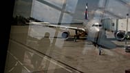 FILE: Through a window, an Aeroflot plane is seen parked for boarding next to a gate of Sheremetyevo airport outside Moscow, 9 July 2013