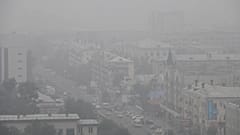 FILE: Heavy smoke covers the center of the eastern Siberian city of Chita, Russia