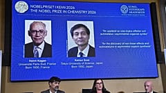 Portraits of Henri Kagan and Kenso Soai are shown on the screen as they are awarded the 2026 Nobel Prize in Chemistry, at the Royal Swedish Academy of Sciences in Stockholm.