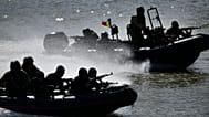 Romanian naval commandos sail in speedboats on the river Danube during a Romanian Navy led exercise outside Mahmudia, Romania, 30 March 2023. 