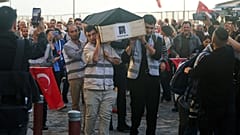 Supporters of the New Party carry a symbolic coffin with a photograph of Izmir Metropolitan Mayor Cemil Tugay during a protest after Tugay joined President Erdogan's AKP.