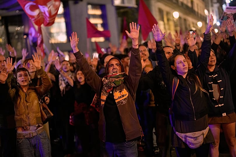 Protesters gather outside the Parliament after the death of María del Carmen Abascal, the 87-year-old woman whose eviction sparked nationwide protests, Madrid, Oct. 7, 2026
