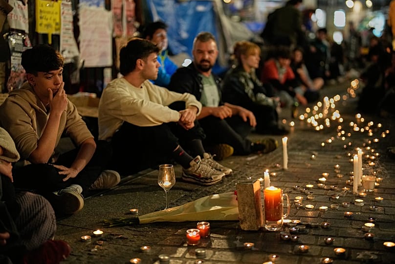 Protesters gather after the reported death of María del Carmen Abascal, the 87-year-old woman whose eviction sparked nationwide protests, Madrid, Wednesday, Oct. 7, 2026
