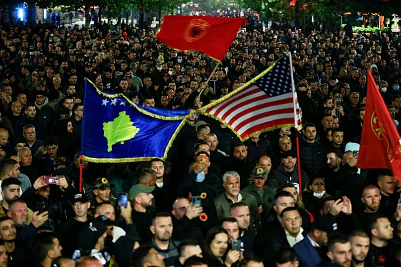 People take part in a protest near the parliament building ahead of the extraordinary parliament session to elect the new president in capital Pristina, Tuesday, Oct. 6, 2026