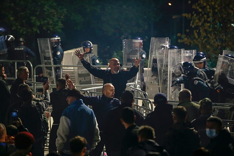People take part in a protest near the parliament building ahead of the extraordinary parliament session to elect the new president in capital Pristina, Tuesday, Oct. 6, 2026
