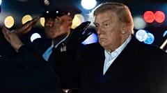 US President Donald Trump salutes as he arrives on Air Force One at Joint Base Andrews, 8 Oct. 2026