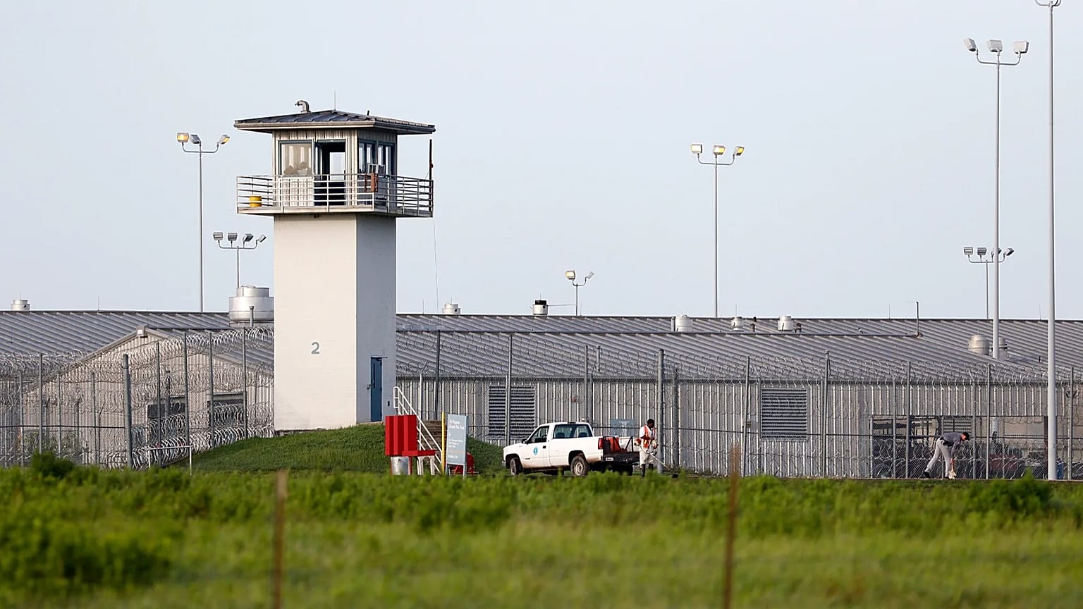 An inmate works outdoors during a hot summer day outside a Texas prison unit in Huntsville, Texas, on June 25, 2015.