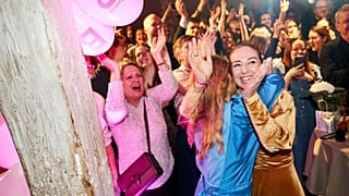 The Social Liberal Party's Zenia Stampe and Samira Nawa react as the first exit polls are released, in Copenhagen, Tuesday, March 24, 2026. 