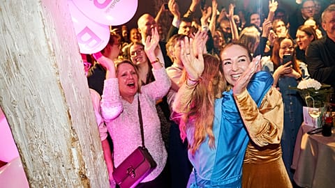 The Social Liberal Party's Zenia Stampe and Samira Nawa react as the first exit polls are released, in Copenhagen, Tuesday, March 24, 2026. 